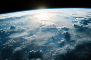 Sunrise over Earth from space, showing clouds and atmosphere. photo