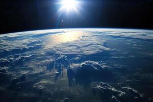 Earth seen from space with sun rays. photo