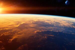 Sunrise over Earth from space, showing clouds and a distant planet. photo