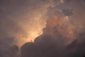 a cloud that is in the sky that is pink and orange photo