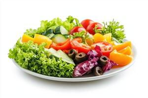 Fresh salad with lettuce, tomatoes, cucumbers, peppers, and olives on a white plate. photo