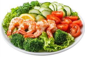 Fresh shrimp salad with broccoli, tomatoes, cucumber, and lemon. photo