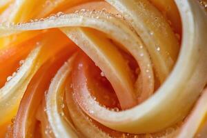 A close up of a carrot with water droplets on it photo