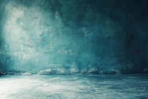 A blue concrete wall with a light source coming from the left side. photo