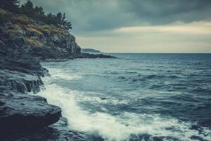 Stormy seascape with crashing waves against a rocky shoreline. photo