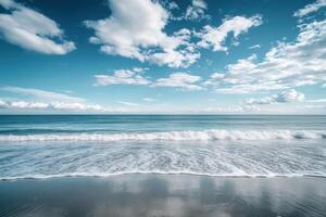A beautiful beach with waves and clouds photo