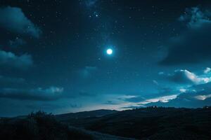 A star shines brightly in the sky over a hill photo