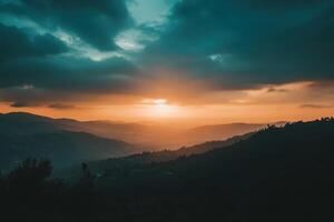 A dramatic sunset over a mountain range, with clouds and a warm orange glow. photo