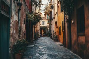 A narrow, cobblestone street in a European city, lined with old buildings. photo