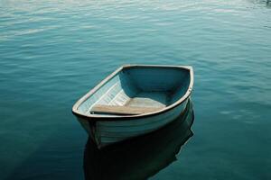 A small blue boat floats peacefully in a calm lake. photo