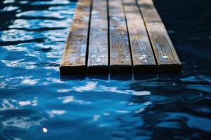 A wooden plank walkway floating on a blue lake. photo