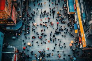 An aerial view of people walking down a street photo