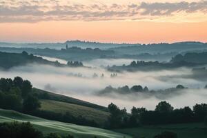 Misty sunrise over rolling hills. photo