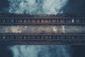 Overhead view of train tracks with smoke. photo