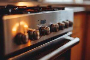 Closeup of a modern stainless steel oven with knobs. photo