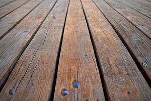 Perspective view of a wooden floor with natural light. photo
