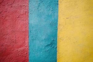 Red, turquoise, and yellow painted wall texture. photo