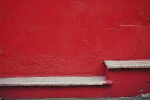 Red wall with two steps. photo