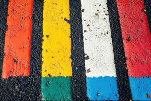 Colorful stripes painted on asphalt. photo