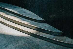 Modern curved stone steps with light and shadow. photo