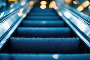 Empty escalator steps leading up to a blurry background. photo