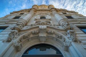 A low angle view of a historic building with intricate stonework. photo