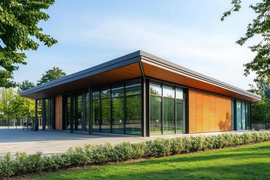 Modern building with large glass windows and wooden siding. photo