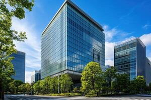Modern glass office buildings with green trees on a sunny day. photo