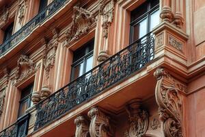 Close-up of an ornate balcony on a historic building. photo