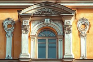 Ornate arched window in a classic building facade. photo