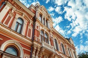 Ornate facade of an old building with a blue sky. photo