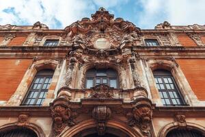 Ornate facade of an old building with intricate stonework. photo