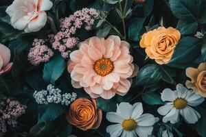 Close-up of a variety of colorful flowers and greenery. photo