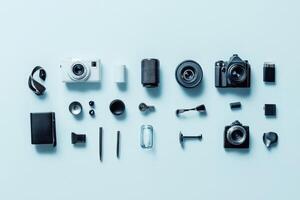 Flat lay of camera and photography accessories on a blue background. photo