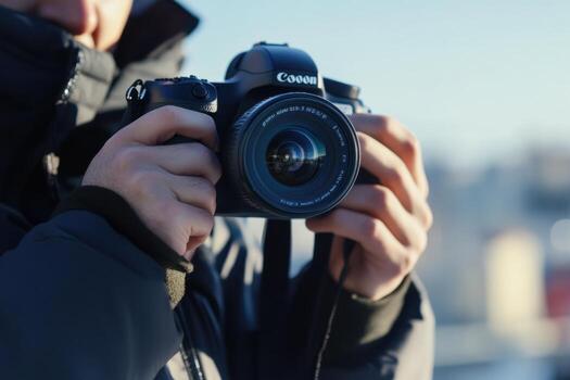 A photographer holds a camera, ready to capture a moment. photo