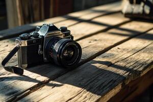 Vintage camera on rustic wooden table. photo