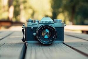 Vintage SLR camera on wooden surface. photo