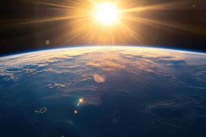 A stunning view of Earth from space with a bright sun shining in the distance. photo
