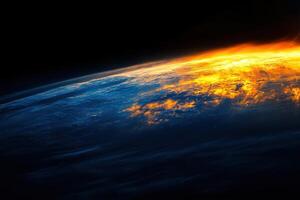Earth's atmosphere ablaze with golden light during a dramatic sunrise. photo