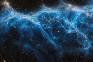 A vibrant blue nebula swirls against a backdrop of countless stars. photo