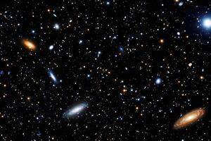 A vibrant field of stars and galaxies, glowing with cosmic light. photo