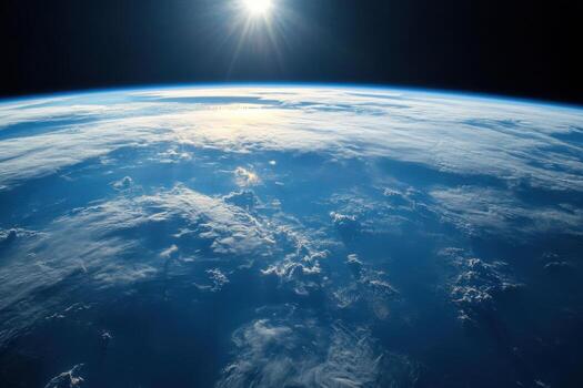 Earthrise seen from space with sunbeams shining through clouds. photo