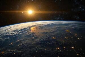 Sunrise over Earth from space, showing clouds, city lights, and a glowing sun. photo