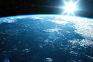 Sunrise over Earth from space, showing the planet's blue oceans, white clouds, and the sun shining brightly. photo