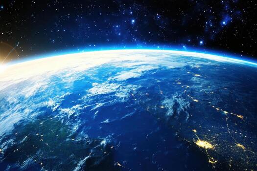 A view of Earth from space, with a sunrise over the horizon. photo