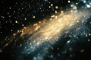 Abstract glowing galaxy with blue and gold particles on a black background. photo
