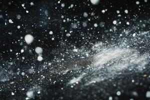 Abstract snow falling on a dark background. photo