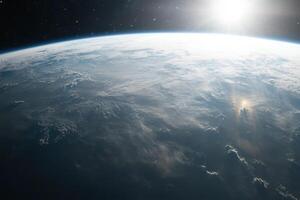 Earth from space with clouds and sun. photo