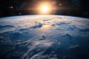 Sunrise over Earth from space, showing clouds and stars. photo