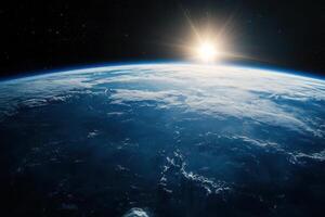 Earthrise with sun shining over the horizon, as seen from space. photo